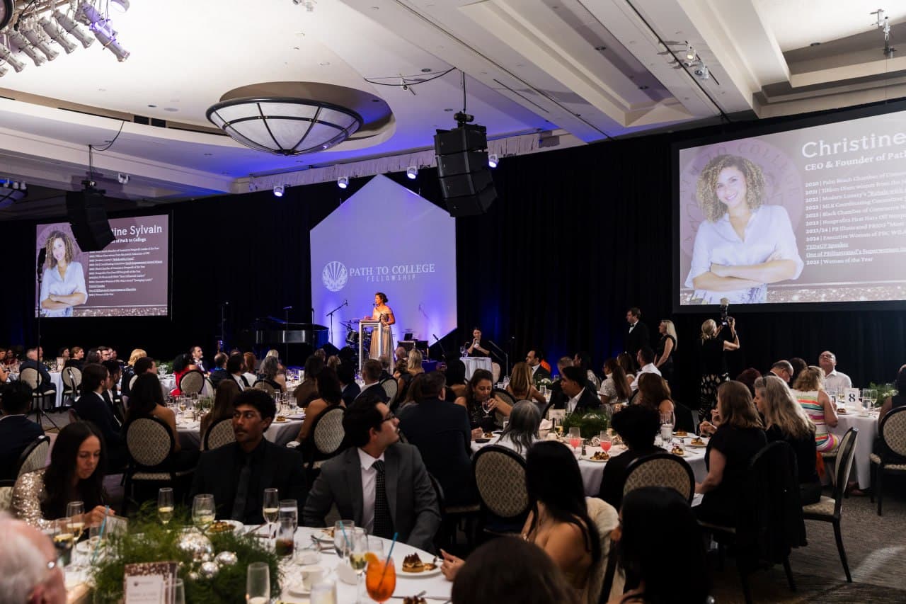 Christine Sylvain speaking at Path to College Fellowship banquet