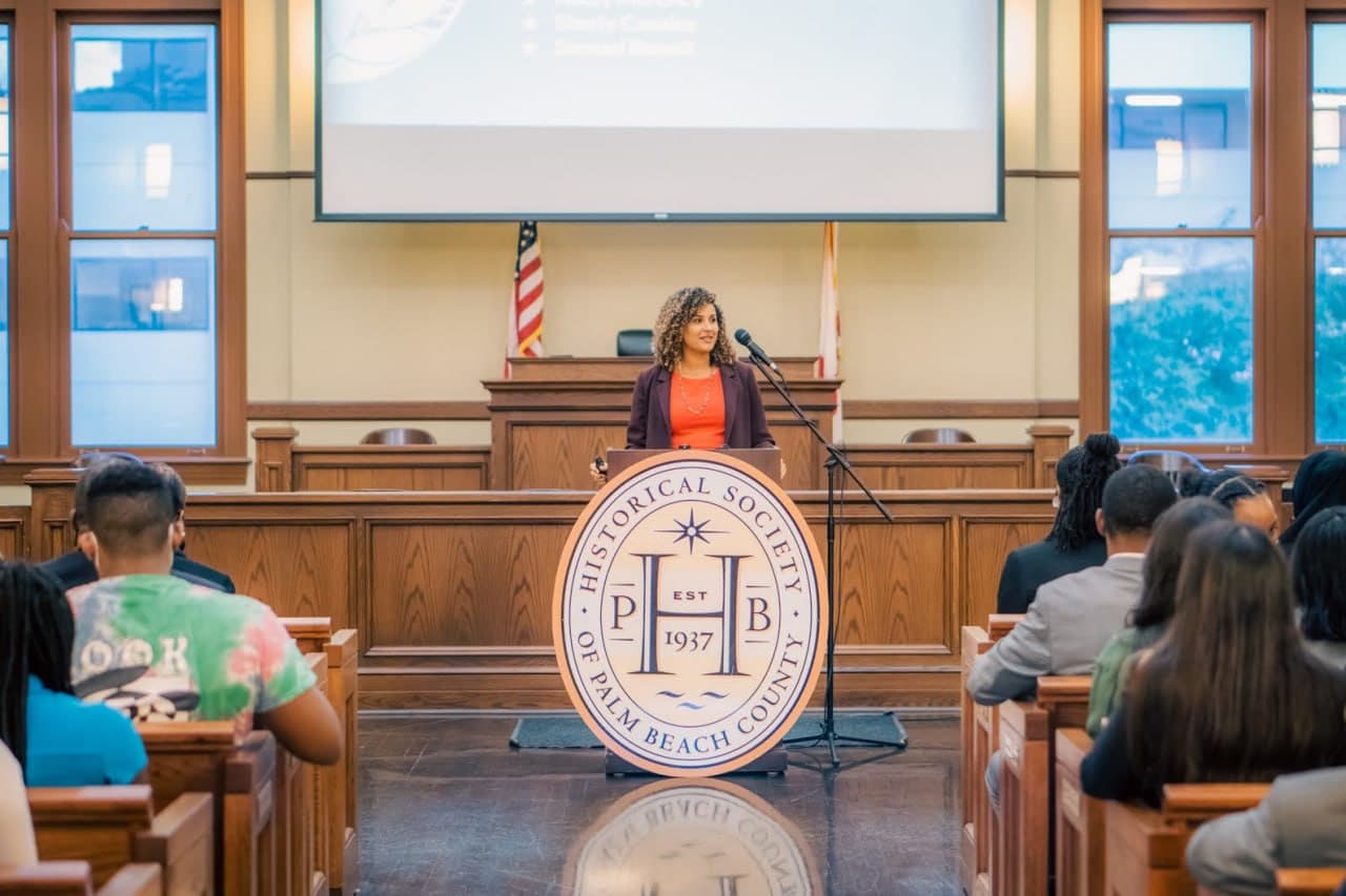 Christine Sylvain speaking at Historical Society of Palm Beach County